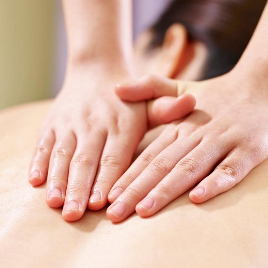 photo of woman getting a Swedish massage